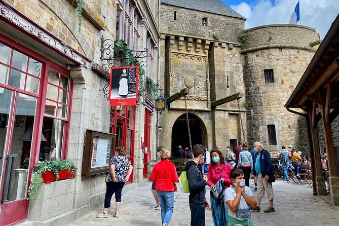 Visitors at the old gate into the village of Mont-Saint-Michel